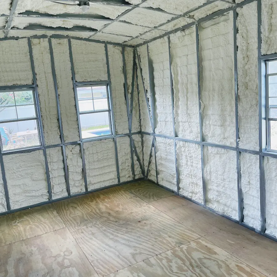 Closed-cell spray foam insulation applied to wall cavities in a residential project in Maize